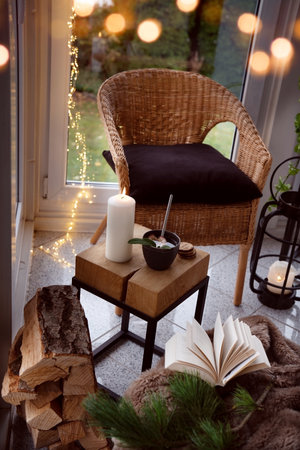 Cozy reading nook with comfortable furnishings and natural light. Vertical background for leisure and relaxation.の写真素材