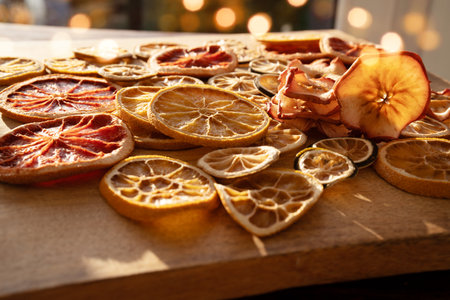 Dried citrus fruits and apple rings on rustic wood for the Christmas.Preparations for Christmas hot drinks.の写真素材