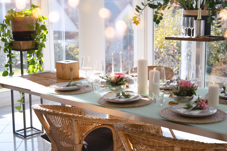 A festively set table for a wedding dinner. Tastefully decorated gastronomy background.の写真素材
