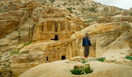 Tourist posing at the entrance to Petra Jordan before the pandemicのeditorial素材