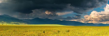 Mountain landscape with storm cloudsの写真素材