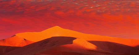 Desert fantasy with red sunsetの写真素材