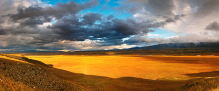 Mountain landscape with cloudy skyの写真素材