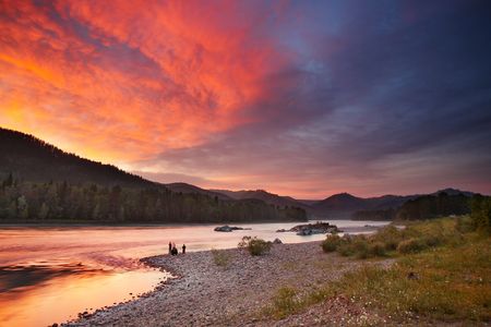 Landscape with river and colorful skyの写真素材