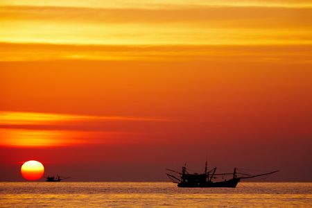 Seascape with fishing boats at sunset, Chang island, Thailandの写真素材