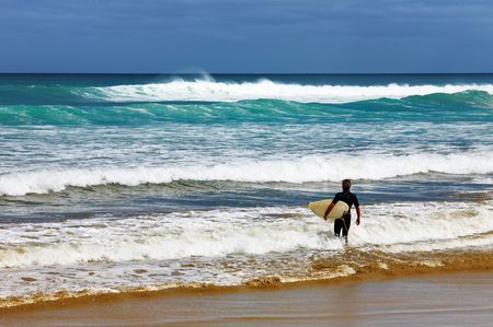 Surfer at the beach, Ninety Mile Beach, New Zealandの写真素材