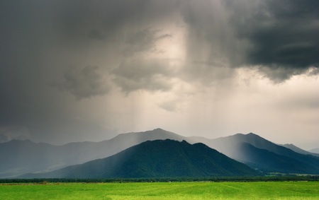 Landscape with mountains and cloudy skyの写真素材