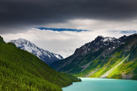 Mountain landscape with lake and storm cloudsの写真素材