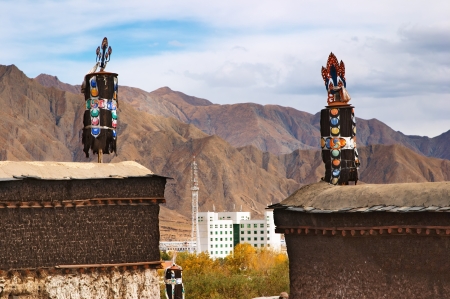 Anciet tibetan monastery and modern buildingの写真素材