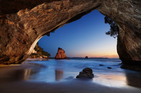 Cathedral Cove at sunrise, Coromandel Peninsula, New Zealandの写真素材