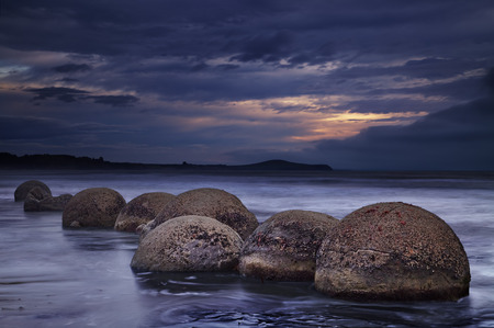 Moeraki Boulders at sunrise, South Island, New Zealandの写真素材