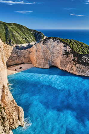 Navagio Beach or Shipwreck Beach is a beautiful natural landmark located on the northwest coast of Zakynthos Island in Ionian Sea in Greeceの写真素材