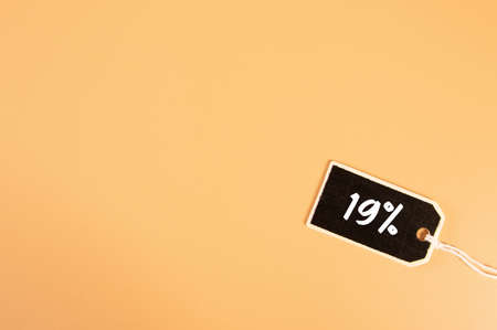 Price tag with 19% text on orange backgroundの写真素材