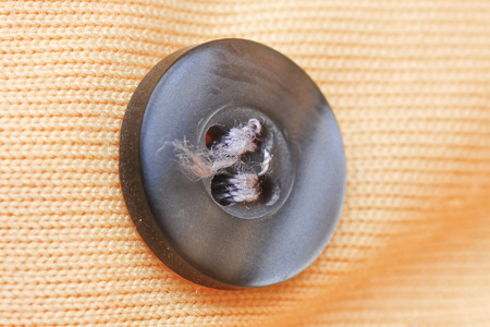 the button clothe with tear seam の写真素材