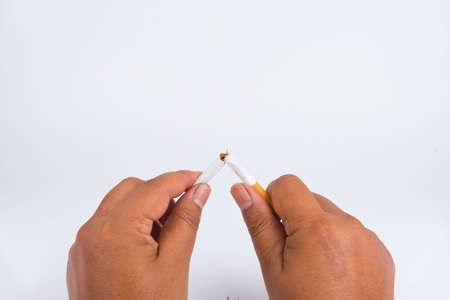 Concept World No Tobacco Day, Stethoscope, Love Paper and a cigarette damaged with isolated white backgroundの写真素材