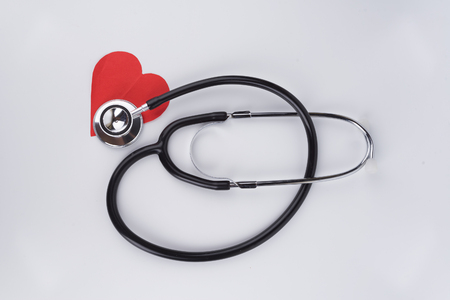 Healthcare Concept stethoscope and Love Red Paper with isolated white backgroundの写真素材