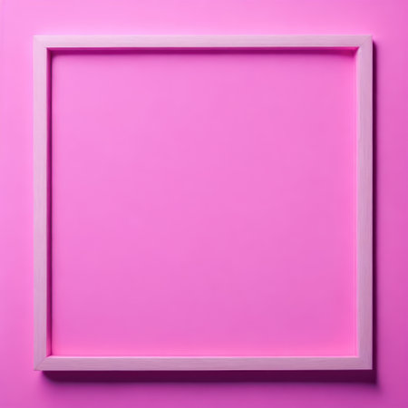 Blank picture frame on pink background, top view. Space for textの写真素材