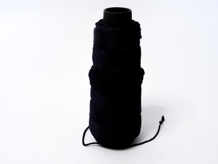 black knitting yarn on a white background