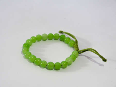 bracelet in batik, wood on white backgroundの写真素材