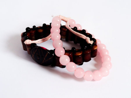 bracelet in brown wood and blue on white backgroundの写真素材