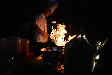 Chef cooking Malaysian Char Kway Teow / Fried rice noodles with flameのeditorial素材