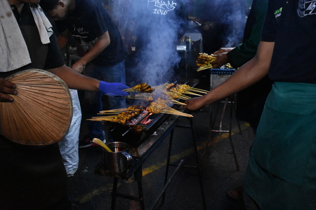 Malaysia local food sate or satay on grill with smoke photo taken in Shah Alam, Malaysiaのeditorial素材
