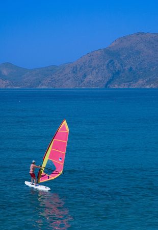 Surfer-beginner tries to subdue her unruly windsurfの写真素材