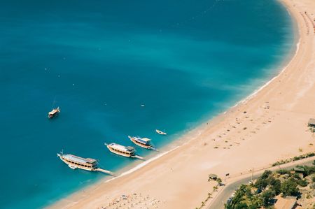 Aerial view on several ships on anchorage near beachの写真素材