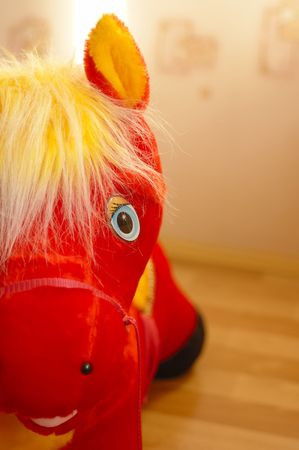 Close-up photo of red toy horse eyeの写真素材