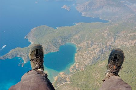 Paraglider's look at the earth below his feetの写真素材