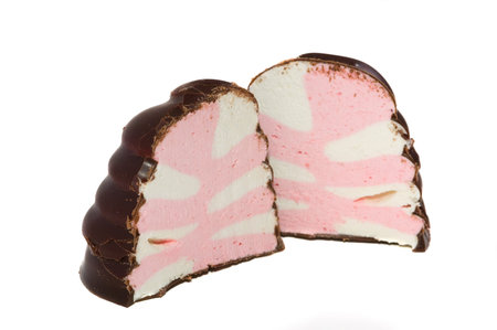 Photo of colored marsh-mallow in chocolate isolated on white background