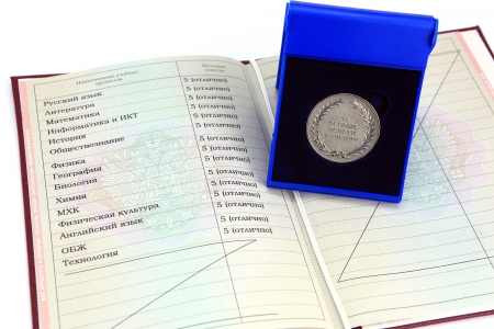 Silver medal  for outstanding achievements in teaching  in a box with a red certificateのeditorial素材