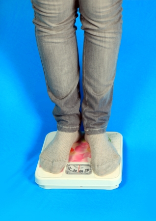 Weighing on the floor scalesの写真素材