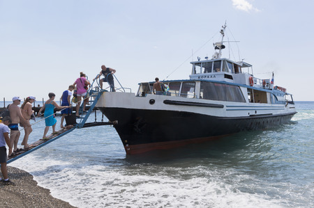 Passengers boarding from the beach resort village Praskoveevka on the ship Coral. Gelendzhik, Krasnodar region, Russiaのeditorial素材