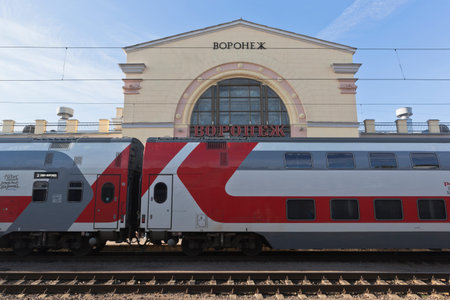 Branded two-storeyed train on the background of the railway station in Voronezh, Russia