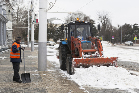 Evpatoria, Crimea, Russia - February 28, 2018: Snow-removing works on the Theater Square in Evpatoria, Crimeaのeditorial素材