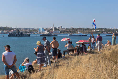 Sevastopol, Crimea, Russia - July 28, 2019: Spectators of the parade on Navy Day on the North side of the Sevastopol Bay, Crimeaのeditorial素材