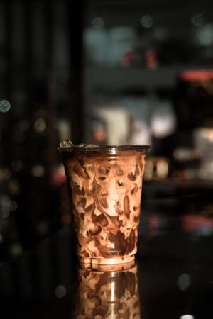 ice latte coffee in plastic glassの写真素材