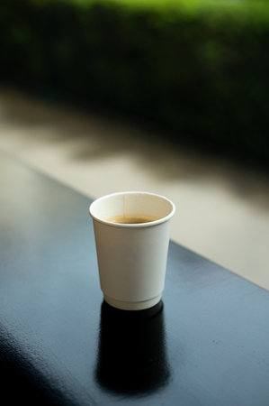 Coffee cup on the table in coffee shop, stock photoの写真素材