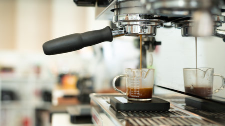 Coffee machine making espresso shot in coffee shop, stock photoの写真素材