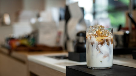 Iced coffee in glass on table in coffee shop, stock photoの写真素材