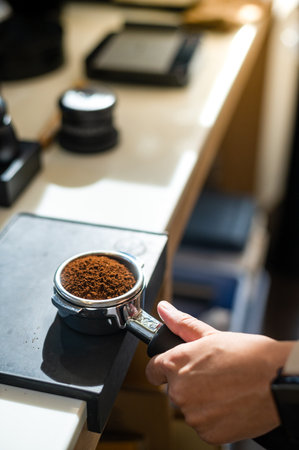 Coffee grinder with ground coffee in coffee shop, stock photoの写真素材