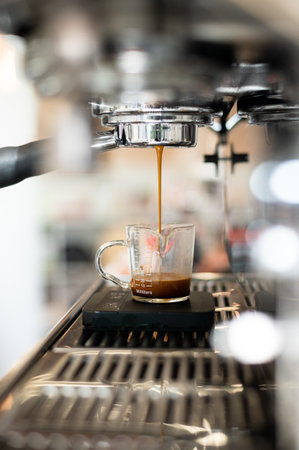 Coffee machine making espresso in coffee shop, shallow depth of fieldの写真素材