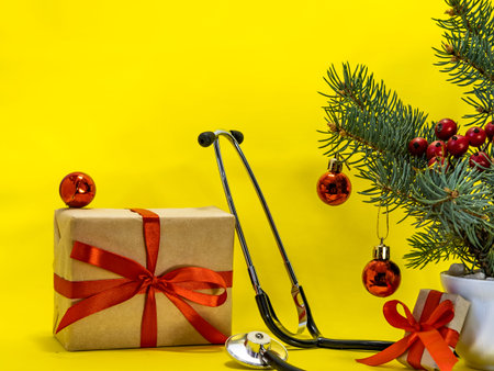 medical worker holiday christmas concept, phonendoscope, christmas tree, boxes with gifts, red balls...