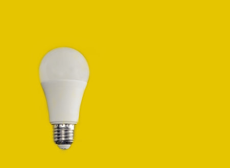 light bulb on yellow background, idea, artificial light source, concept of new ideas, top view, copy...