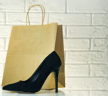 Black high-heeled shoes. Womens shoes with heels. A pair of womens Black patent leather shoes on a white backgroundの写真素材