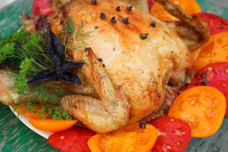 Fried chicken with tomatoesの写真素材