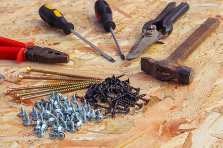 construction tools: pliers hammer shears screwdriver ommerce and screws