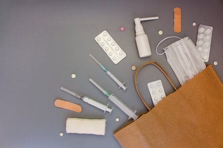 Medicines fall out of bags on table. Top view.の写真素材