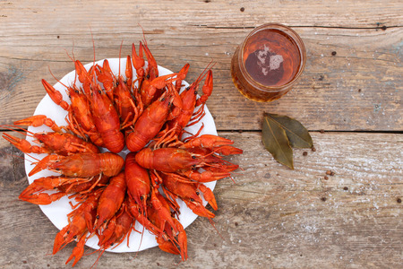 Crawfish and beer on the old wooden background. Top view.の写真素材